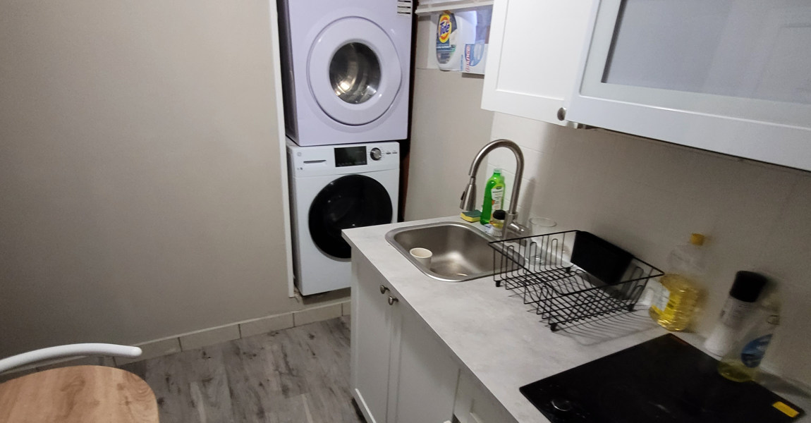 Modern, super-convenient downstairs Full-Kitchenette, complete with table and chairs, sink, cupboards, refrigerator, stove top, microwave, toaster oven, and a DISHWASHER!!