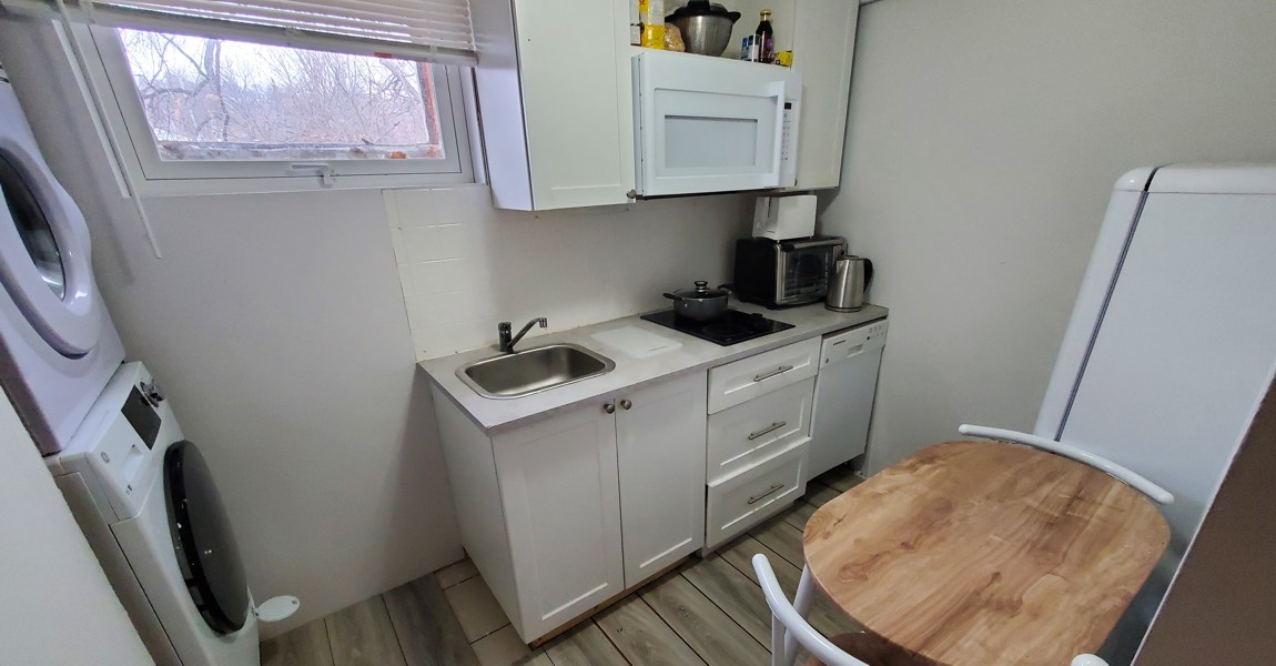 Beautiful, Brand-new Kitchenette Downstairs, with Table and Chairs, and a Washer and Dryer
